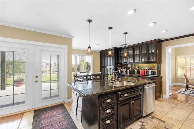40678 Alondra Dr, Murrieta, CA 92562 - kitchen with appliances with stainless steel finishes, a sink, a kitchen bar, baseboards, and crown molding