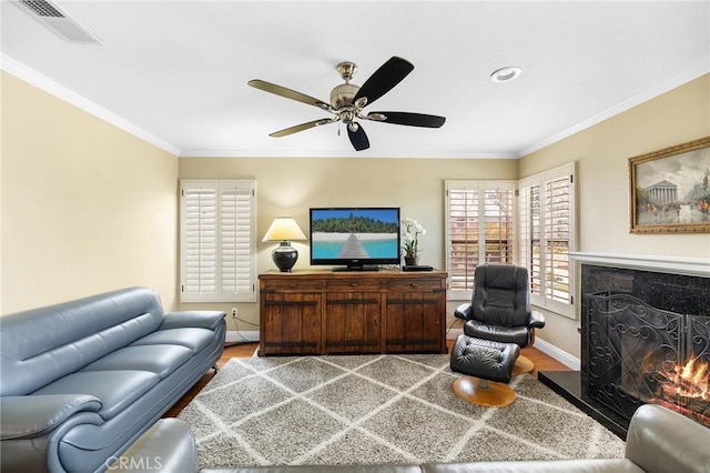 40678 Alondra Dr, Murrieta, CA 92562 - living room with wood finished floors, a fireplace, baseboards, ceiling fan, and ornamental molding