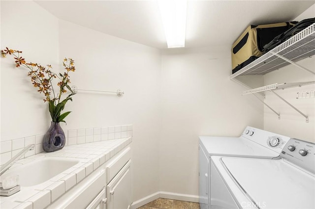 40678 Alondra Dr, Murrieta, CA 92562 - laundry room with washing machine and dryer, cabinet space, and baseboards