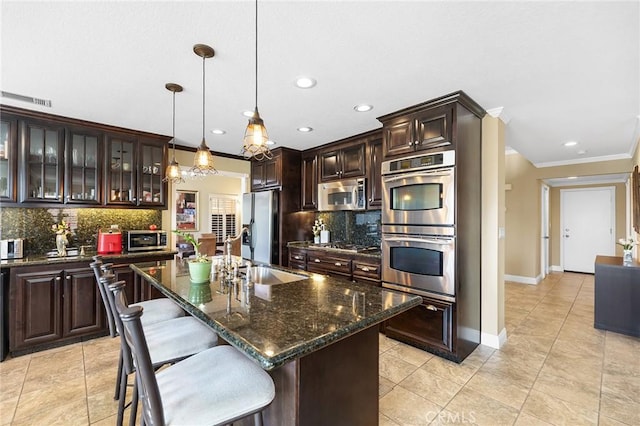40678 Alondra Dr, Murrieta, CA 92562 - kitchen with appliances with stainless steel finishes, a sink, tasteful backsplash, ornamental molding, and dark brown cabinets