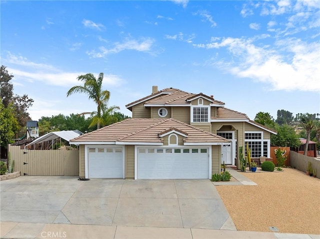 40678 Alondra Dr, Murrieta, CA 92562 - traditional-style house featuring a tiled roof, a chimney, concrete driveway, and a garage