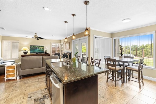 40678 Alondra Dr, Murrieta, CA 92562 - kitchen featuring a sink, healthy amount of natural light, dishwasher, a textured ceiling, and ornamental molding