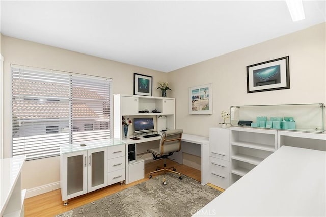40678 Alondra Dr, Murrieta, CA 92562 - office area with light wood-type flooring, built in desk, and baseboards