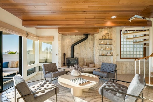 708 The Strand, Manhattan Beach, CA 90266 - living area featuring a wood stove, wooden ceiling, and stairway