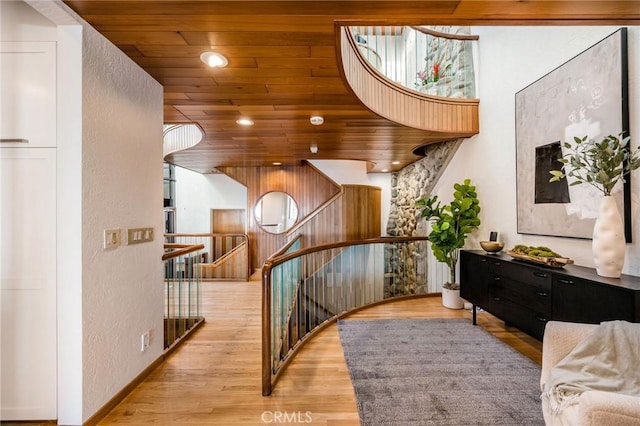 708 The Strand, Manhattan Beach, CA 90266 - stairs with wood finished floors, a textured wall, recessed lighting, and baseboards