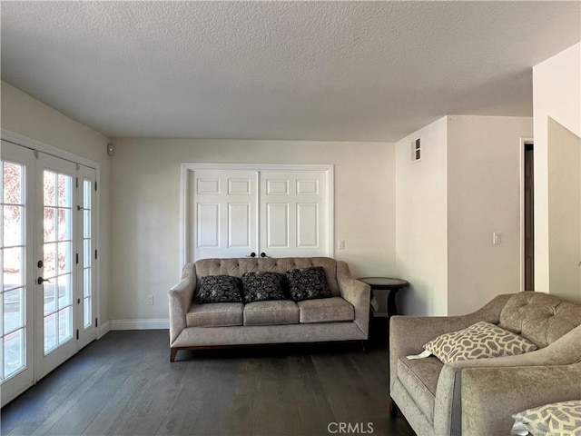 21265 E Fort Bowie Dr, Walnut, CA 91789 - living room with dark wood-style floors, baseboards, a textured ceiling, and french doors