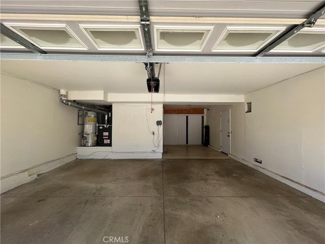 21265 E Fort Bowie Dr, Walnut, CA 91789 - garage featuring water heater, a garage door opener, and baseboards
