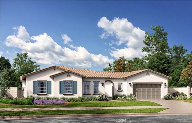 6525 Etiwanda Ave, Rancho Cucamonga, CA 91739 - mediterranean / spanish home with a tiled roof, concrete driveway, stucco siding, and an attached garage