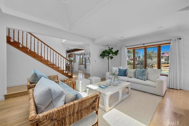 1330 8th St, Manhattan Beach, CA 90266 - living room featuring stairs, light wood-style flooring, and baseboards