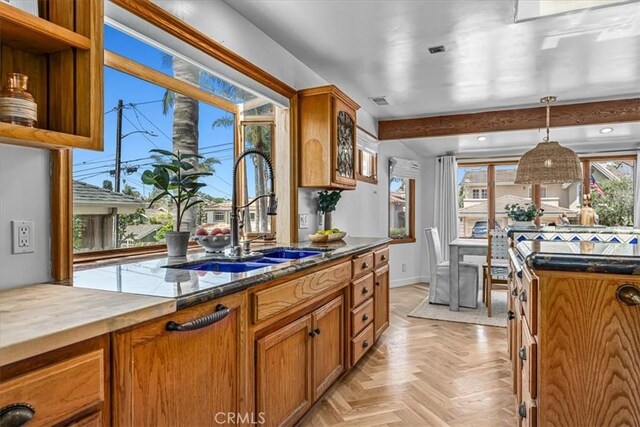 1330 8th St, Manhattan Beach, CA 90266 - kitchen with a sink, brown cabinetry, hanging light fixtures, and butcher block counters