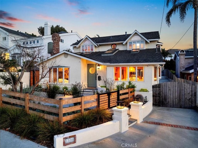 1330 8th St, Manhattan Beach, CA 90266 - view of front of home featuring stucco siding, a shingled roof, a fenced front yard, and a gate