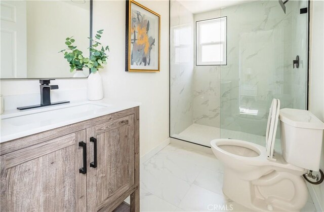 14609 Clark St, Baldwin Park, CA 91706 - bathroom featuring marble look tile flooring, toilet, vanity, a marble finish shower, and baseboards