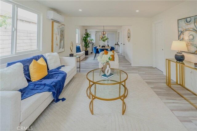 14609 Clark St, Baldwin Park, CA 91706 - living area featuring an AC wall unit, light wood-type flooring, and recessed lighting