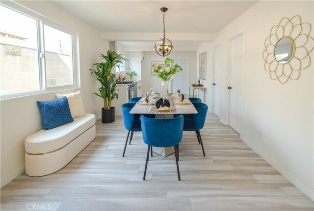 14609 Clark St, Baldwin Park, CA 91706 - dining space with a chandelier, light wood-type flooring, and baseboards