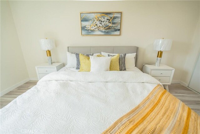14609 Clark St, Baldwin Park, CA 91706 - bedroom featuring wood finished floors and baseboards