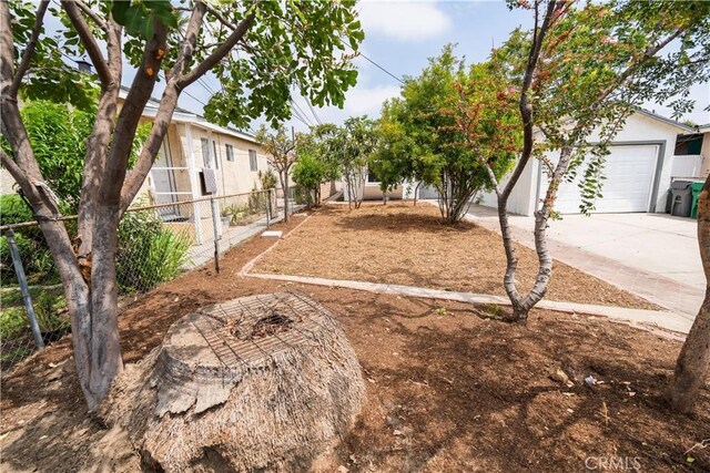 14609 Clark St, Baldwin Park, CA 91706 - view of yard with a garage and concrete driveway