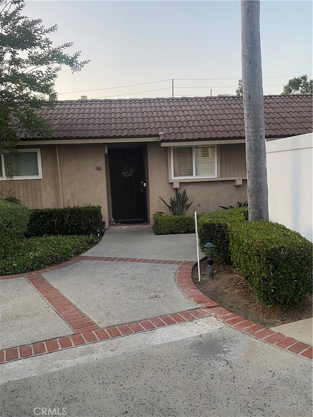 708 W Lambert Rd Unit 6, La Habra, CA 90631 - view of front of property featuring a tile roof and stucco siding