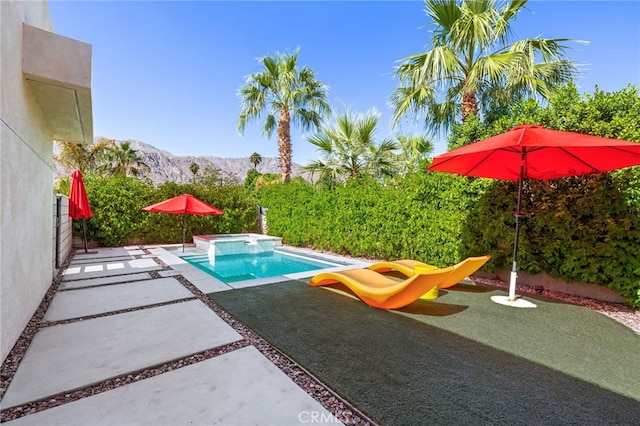 52300 Avenida Velasco Ln, Quinta, CA 92253 - view of swimming pool with a mountain view, a patio, and a pool with connected hot tub