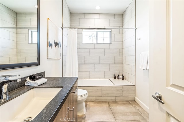 52300 Avenida Velasco Ln, Quinta, CA 92253 - full bathroom featuring vanity, shower / bath combo with shower curtain, toilet, tile patterned flooring, and baseboards