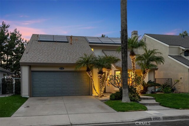 21321 Spruce, Mission Viejo, CA 92692 - view of front of home with concrete driveway, a garage, and solar panels