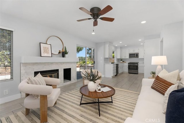 21321 Spruce, Mission Viejo, CA 92692 - living room with ceiling fan, a glass covered fireplace, and recessed lighting