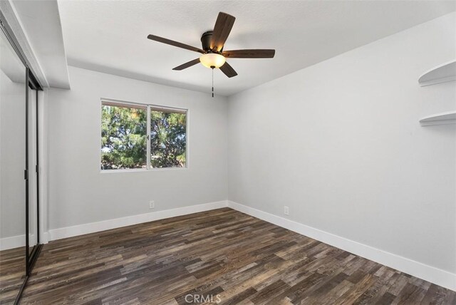21321 Spruce, Mission Viejo, CA 92692 - unfurnished bedroom with dark wood-style floors, a closet, and ceiling fan