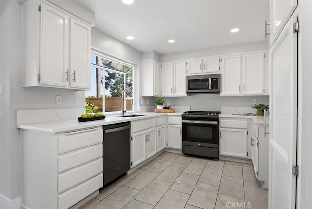 21321 Spruce, Mission Viejo, CA 92692 - kitchen featuring appliances with stainless steel finishes, white cabinets, recessed lighting, and light stone countertops