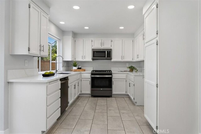 21321 Spruce, Mission Viejo, CA 92692 - kitchen featuring appliances with stainless steel finishes, white cabinetry, light countertops, and recessed lighting