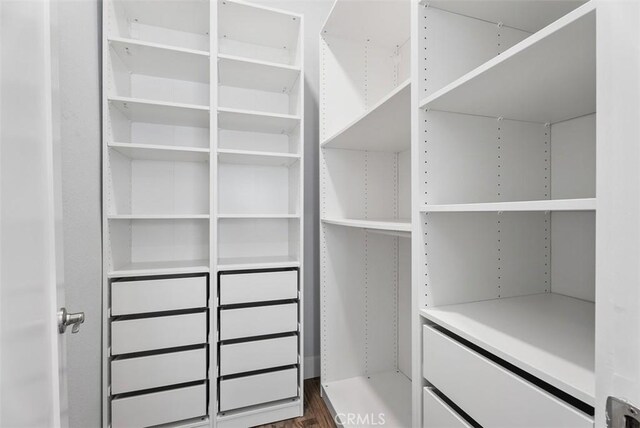 21321 Spruce, Mission Viejo, CA 92692 - walk in closet with dark wood-style floors
