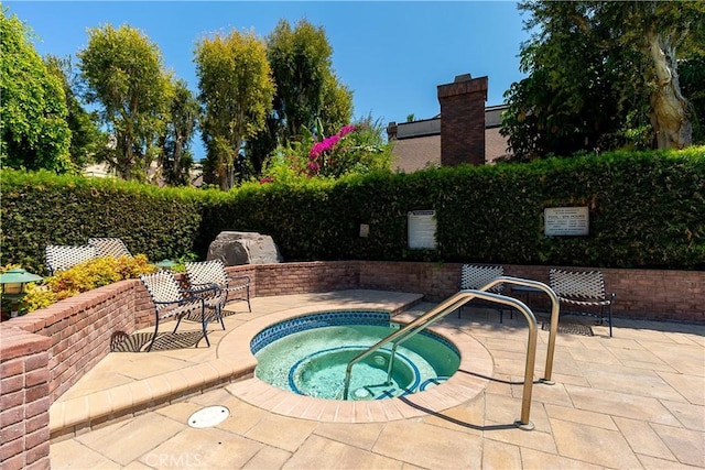 18759 Hatteras St Unit 25, Tarzana, CA 91356 - view of swimming pool with a hot tub and a patio area