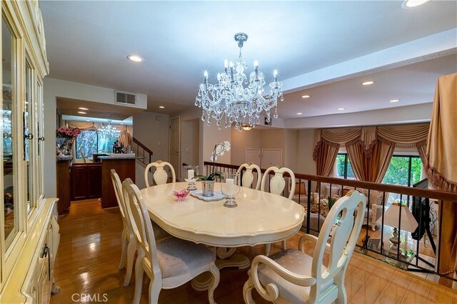 18759 Hatteras St Unit 25, Tarzana, CA 91356 - dining room featuring recessed lighting, a chandelier, stairway, and light wood finished floors