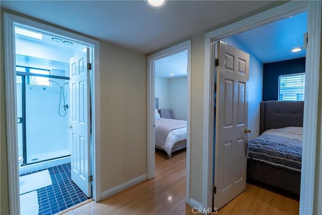 18759 Hatteras St Unit 25, Tarzana, CA 91356 - corridor featuring light wood-style floors and baseboards