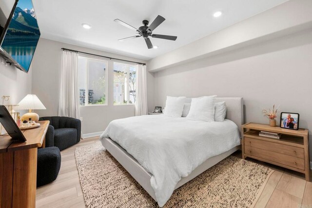 7902 Belluno Way, San Diego, CA 92126 - bedroom with light wood-style floors, recessed lighting, and a ceiling fan