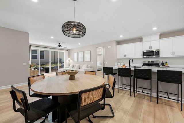 7902 Belluno Way, San Diego, CA 92126 - dining room with a ceiling fan, recessed lighting, light wood-type flooring, and baseboards