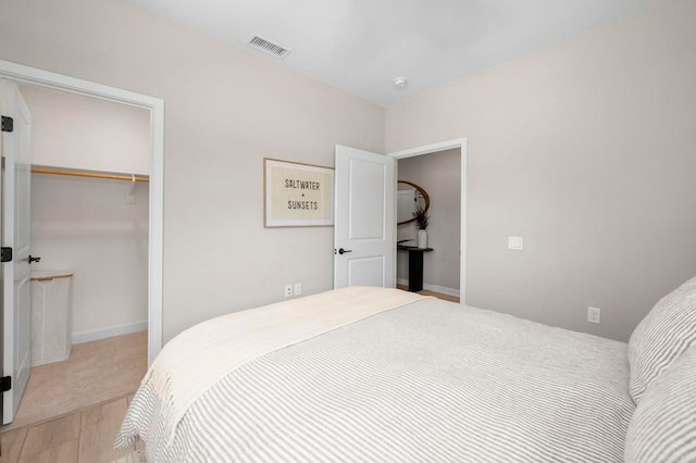 7902 Belluno Way, San Diego, CA 92126 - bedroom with a closet, wood finished floors, and a spacious closet