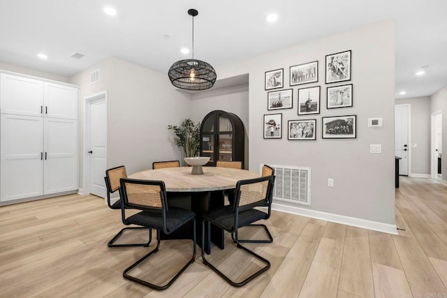 7902 Belluno Way, San Diego, CA 92126 - dining space featuring recessed lighting, light wood-type flooring, baseboards, and arched walkways