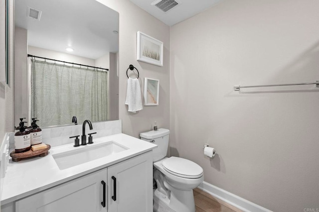 7902 Belluno Way, San Diego, CA 92126 - full bathroom featuring toilet, vanity, baseboards, and wood finished floors
