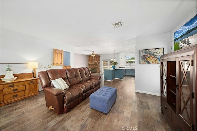 43220 51st St W, Quartz Hill, CA 93536 - living room with dark wood-type flooring and baseboards