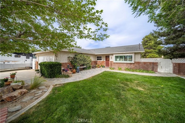 43220 51st St W, Quartz Hill, CA 93536 - single story home featuring brick siding, stucco siding, a garage, and a gate