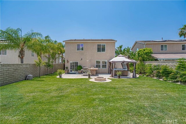 28217 Alton Way, Castaic, CA 91384 - back of property featuring a patio area, a fire pit, a gazebo, and stucco siding