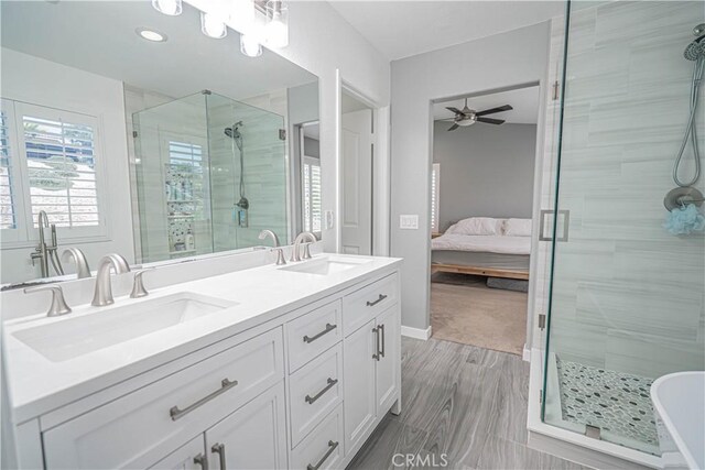 28217 Alton Way, Castaic, CA 91384 - ensuite bathroom featuring a stall shower, double vanity, a ceiling fan, a freestanding tub, and recessed lighting
