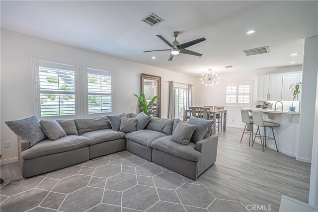 28217 Alton Way, Castaic, CA 91384 - living area with baseboards, ceiling fan, recessed lighting, light wood finished floors, and a chandelier