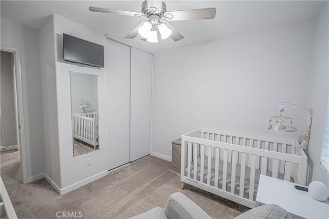 28217 Alton Way, Castaic, CA 91384 - carpeted bedroom with baseboards, a closet, a ceiling fan, and a crib
