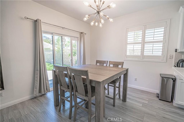 28217 Alton Way, Castaic, CA 91384 - dining area featuring a chandelier, baseboards, and light wood-type flooring