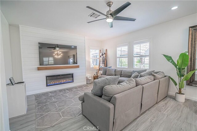 28217 Alton Way, Castaic, CA 91384 - living room featuring ceiling fan, a large fireplace, baseboards, recessed lighting, and wood finished floors