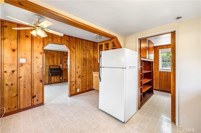 920 W Elberon Ave, San Pedro, CA 90731 - kitchen featuring freestanding refrigerator, light flooring, wood walls, and ceiling fan