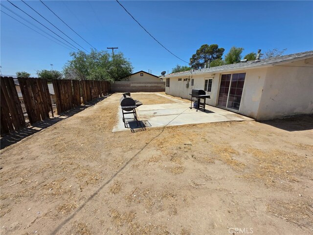15533 Louise St, Victorville, CA 92395 - fenced backyard featuring a patio area