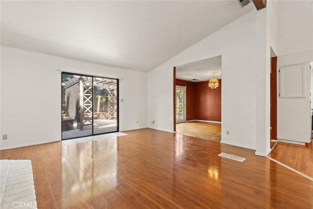 2631 San Jose St, Chico, CA 95973 - unfurnished room with wood finished floors, a chandelier, and high vaulted ceiling