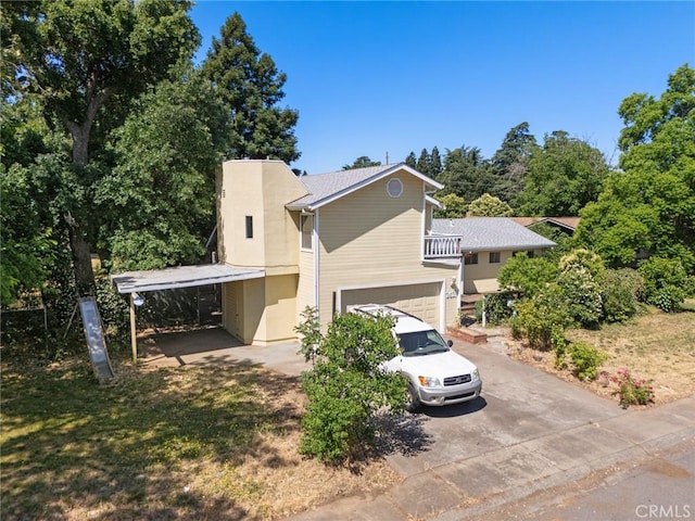 2631 San Jose St, Chico, CA 95973 - view of side of home with a carport, a garage, and driveway