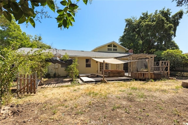 2631 San Jose St, Chico, CA 95973 - back of property featuring a hot tub, a wooden deck, and stucco siding